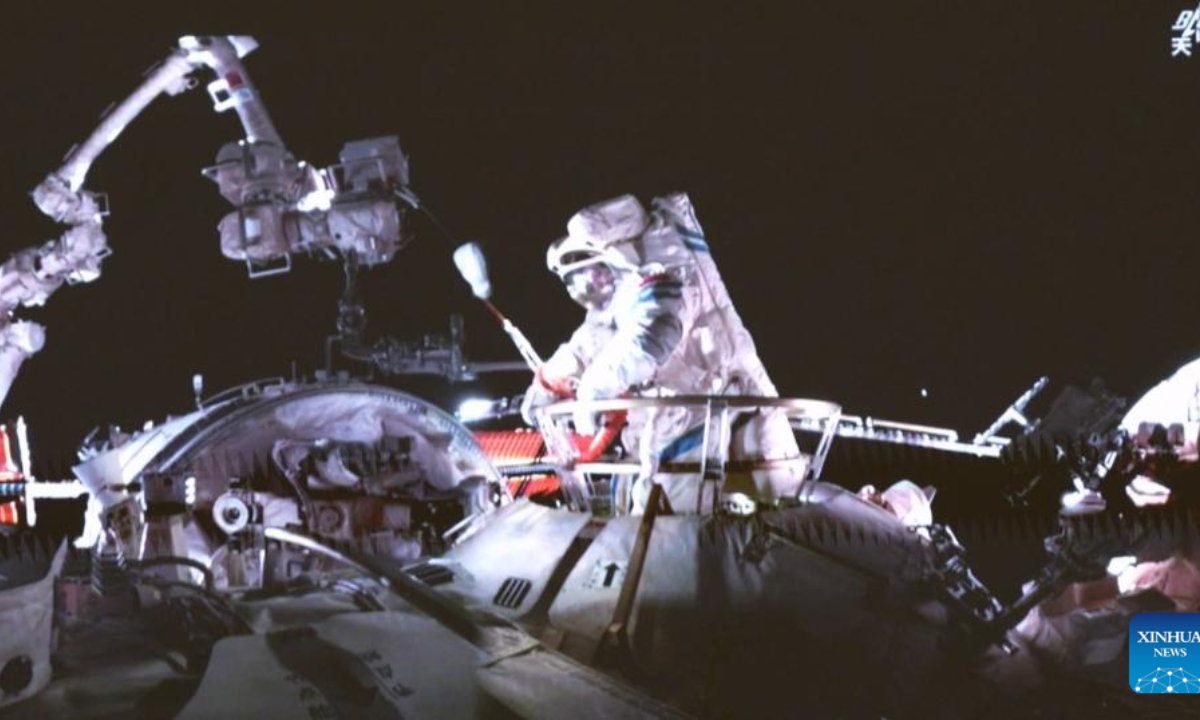 This video screenshot taken at Beijing Aerospace Control Center on May 22, 2025 shows Shenzhou-20 astronaut Chen Dong leaving China's orbiting space station for extravehicular activities. The Shenzhou-20 crew on board China's orbiting space station completed their mission's first series of extravehicular activities on Thursday, according to the China Manned Space Agency. (Xinhua/Li Yanchen)